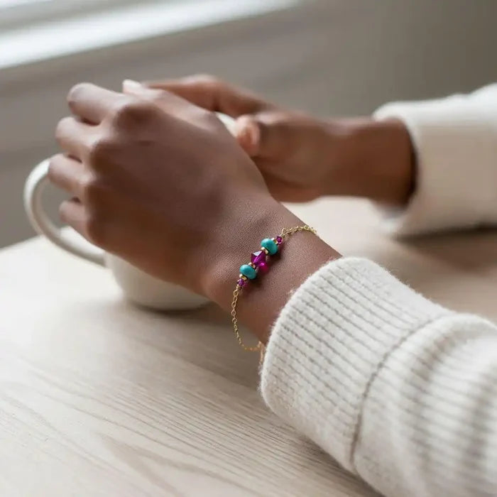Handmade Gold Filled Pink Turquoise Gemstone Bracelet worn on a wrist, showcasing vibrant pink and turquoise gemstones.