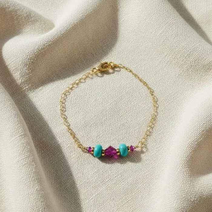 Handmade Gold Filled Pink Turquoise Gemstone Bracelet featuring fuchsia Swarovski crystals and turquoise stones.