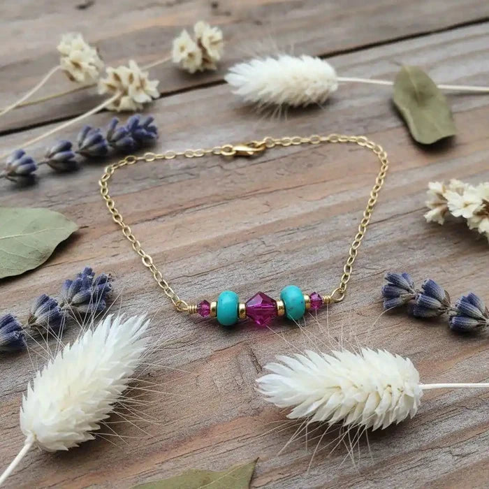 Handmade Gold Filled Pink Turquoise Gemstone Bracelet featuring turquoise gemstones and fuchsia Swarovski crystals.