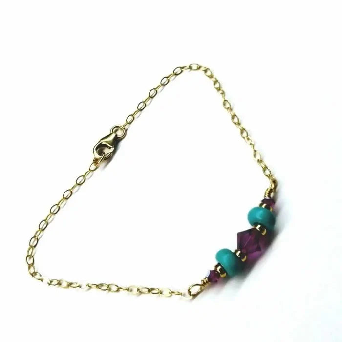 Handmade Gold Filled Pink Turquoise Gemstone Bracelet featuring pink fuchsia Swarovski crystals and turquoise beads.