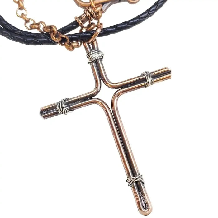 Handmade Large Copper and Silver Wire Cross Necklace for Men with leather cord, showcasing artisan craftsmanship.