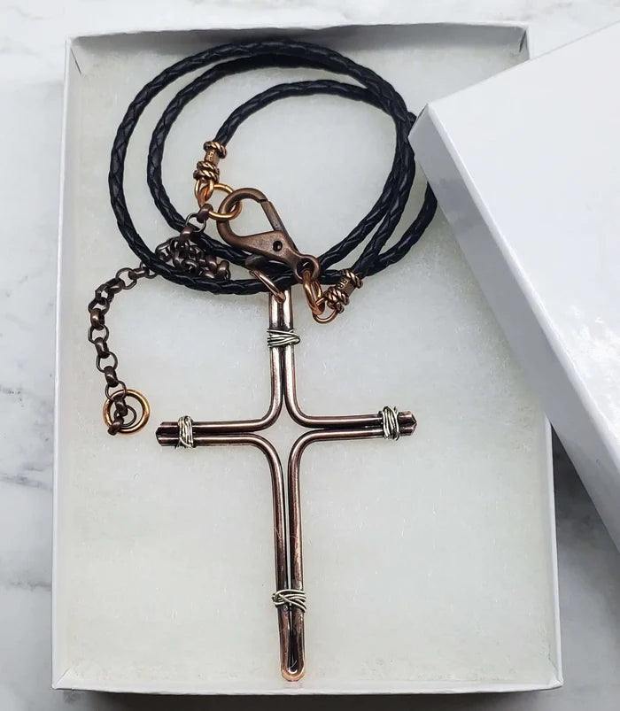 Handmade Large Copper and Silver Wire Cross Necklace for Men displayed in a gift box with braided cord.
