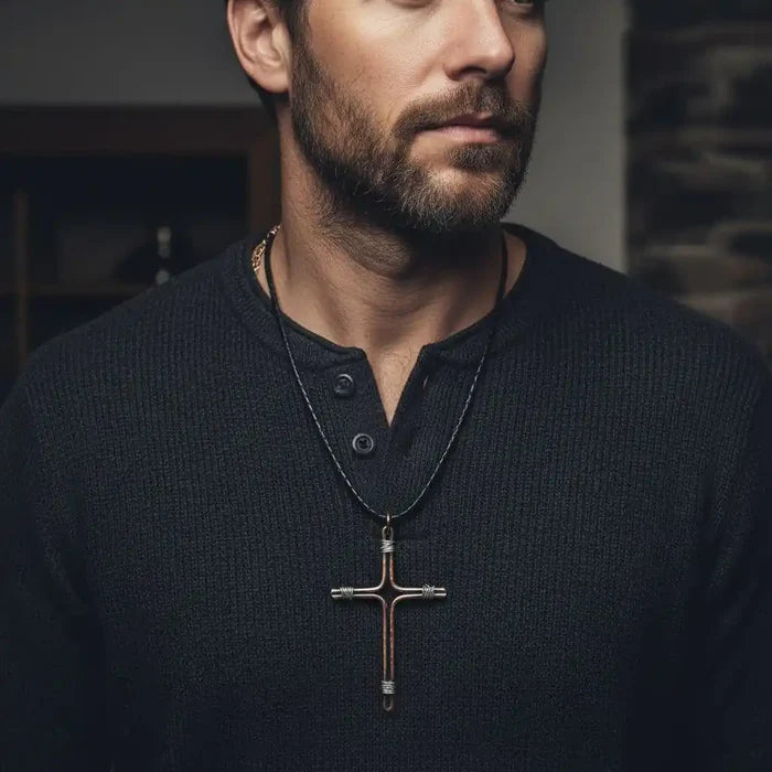Handmade Large Copper and Silver Wire Cross Necklace for Men worn by a man in a dark sweater.