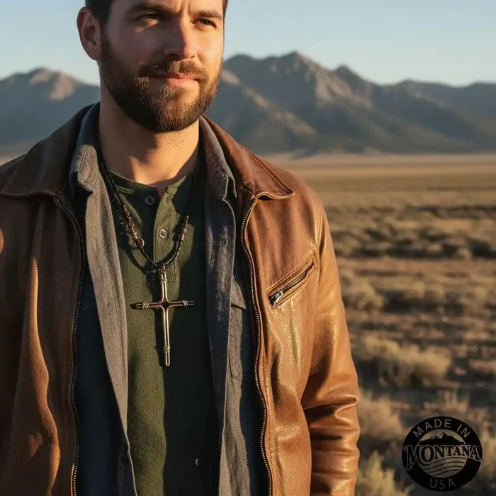 Handmade Large Copper and Silver Wire Cross Necklace for Men worn by a man in a brown leather jacket in a scenic outdoor landscape.