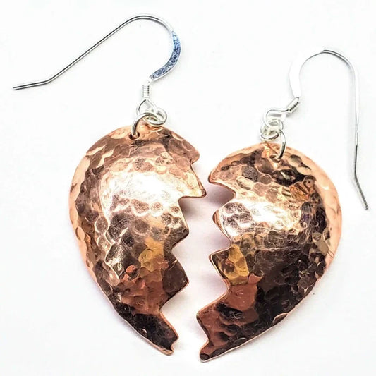 Handmade Sculpted Copper Broken Heart Earrings with a hammered finish highlighting unique artisan craftsmanship.
