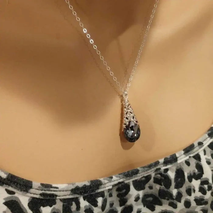 Handmade Sculpted Wrapped Rose Gold Filigree Crystal Necklace displayed on a mannequin with a black diamond crystal pendant.