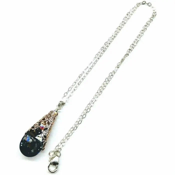 Handmade Sculpted Wrapped Rose Gold Filigree Crystal Necklace featuring a black diamond Swarovski crystal pendant.