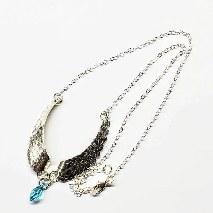 Handmade Silver Forged Sculpted Angel Wings Necklace with Swarovski crystal teardrop attached.