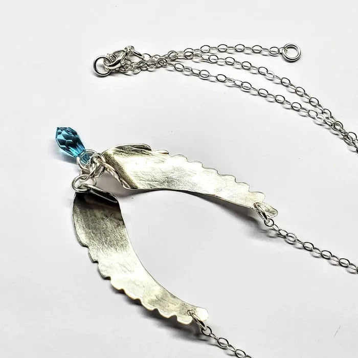 Handmade Silver Forged Sculpted Angel Wings Necklace featuring a Swarovski crystal teardrop.