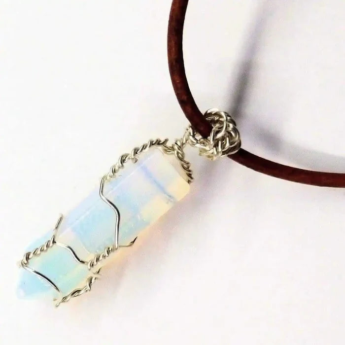 Handmade Silver Wire Wrapped Gemstone Crystal Point Pendant showcasing a stunning crystal point wrapped in silver wire.