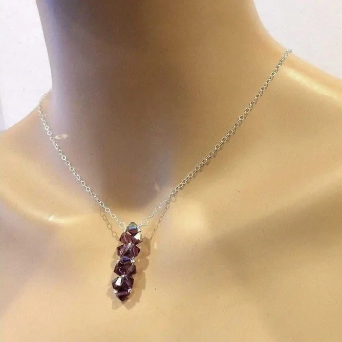 Handmade Wire Colored Woven Crystal Rock Candy Necklace featuring purple Swarovski crystal bicones on a silver chain.
