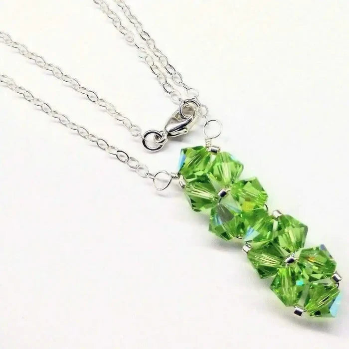 Handmade Wire Colored Woven Crystal Rock Candy Necklace featuring vibrant green Swarovski crystals on a delicate silver chain.