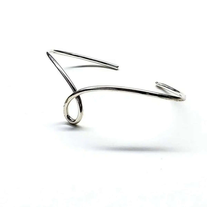 Handmade Wire Sculpted Silver Teardrop Bangle showcasing elegant wire design.