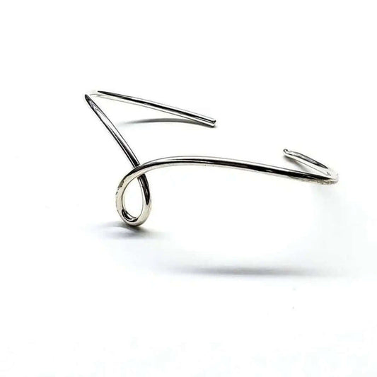 Handmade Wire Sculpted Silver Teardrop Bangle showcasing elegant wire design.