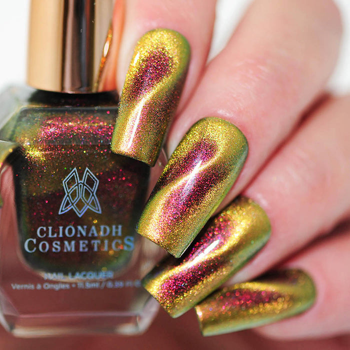 Close up of nails done with Hazard Nail Lacquer featuring a design to show off the magnetic effect on fair skin tone.