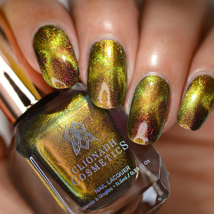 Close up shot of nails done with Hazard Nail Lacquer featuring a design to show off the magnetic effect on medium skin tone