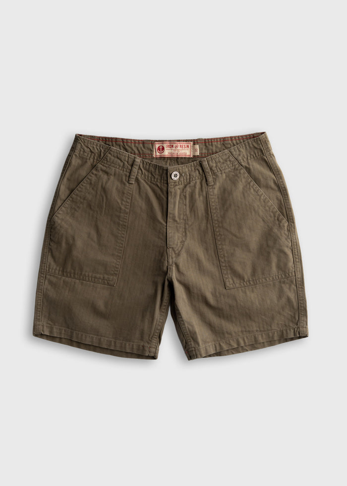 Olive green shorts with front pockets and button closure, labeled "Iron and Resin," displayed on a plain white background.
