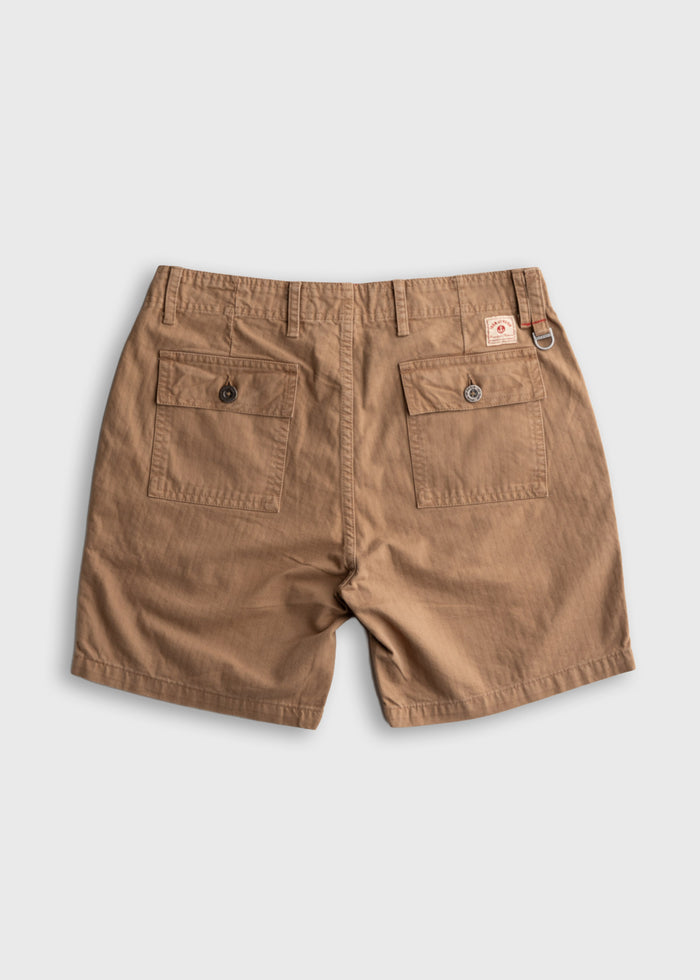 Khaki shorts with two back pockets and a small logo tag on the right. The shorts have belt loops and a metal ring detail.