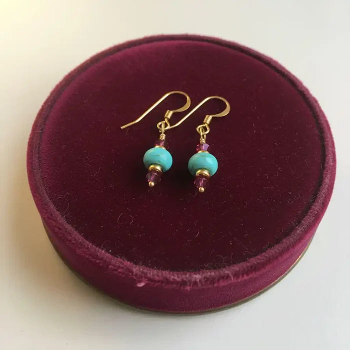 Hot Pink and Turquoise Gemstone14 K Gold Filled Earrings displayed on a round burgundy velvet box.