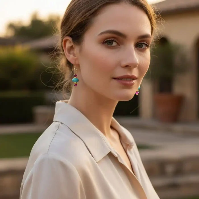 Model showcasing Hot Pink and Turquoise Gemstone14 K Gold Filled Earrings in outdoor setting.