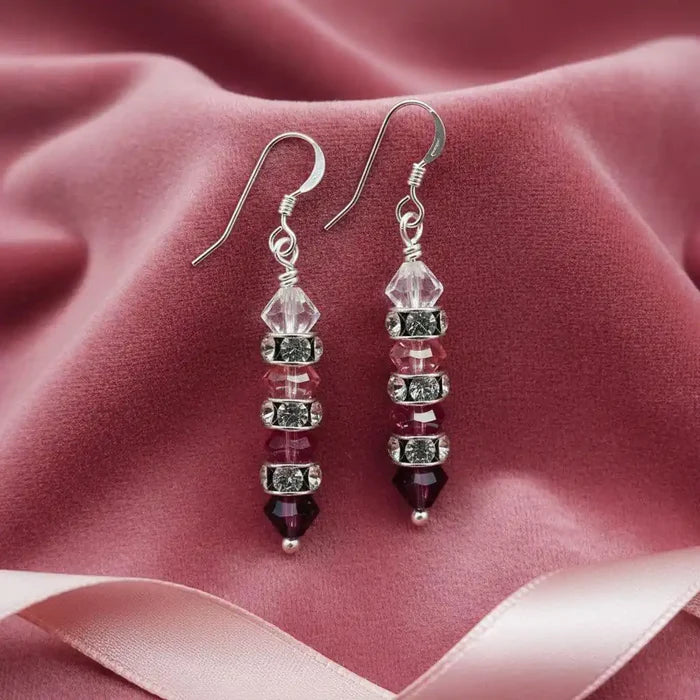 Hot Pink Ombre Stacked Crystal Sterling Silver Earrings on soft pink fabric background.