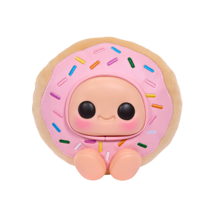 Donut-shaped toy with a face on a white background