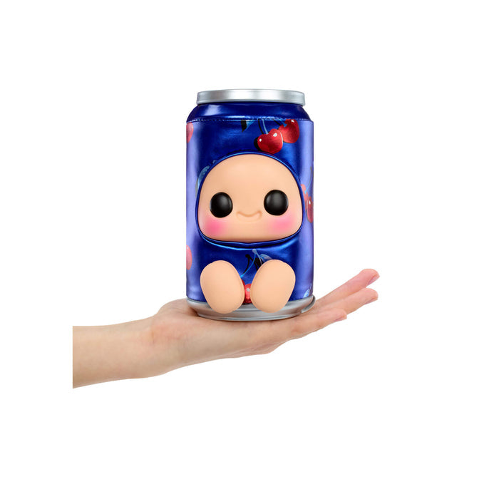 Blue can like figure with cherries on it held in a hand on a white background