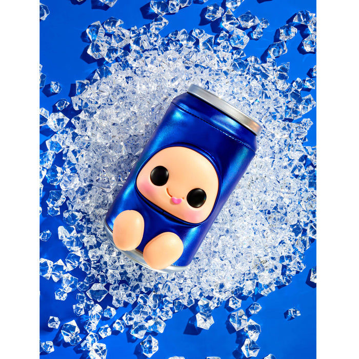 A glossy blue "can" with a cute cartoon character face and peach-colored feet, surrounded by scattered clear ice cubes on a bright blue background.