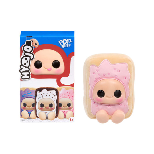 Toy figure of a character with a pink head and black eyes, next to its packaging.