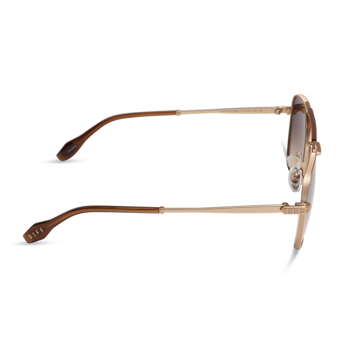 diff eyewear x stephen wilson jr. i'm a song navigator sunglasses with a gold metal frame and brown gradient lenses side view