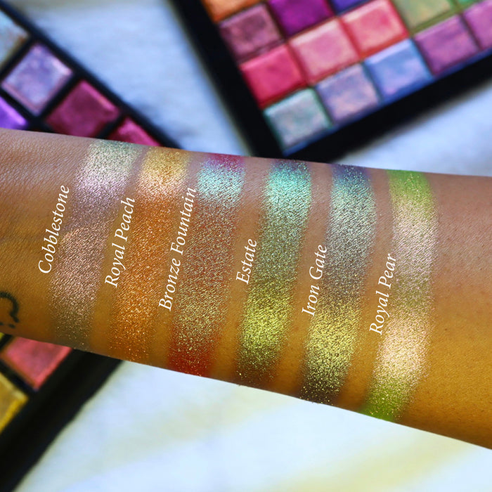 Straight angled arm swatches on medium skin tone of Iron Gate Earth Vibrant Multichrome Eyeshadow shifts compared to Cobblestone, Royal Peach, Bronze Fountain, Estate and Royal Pear
