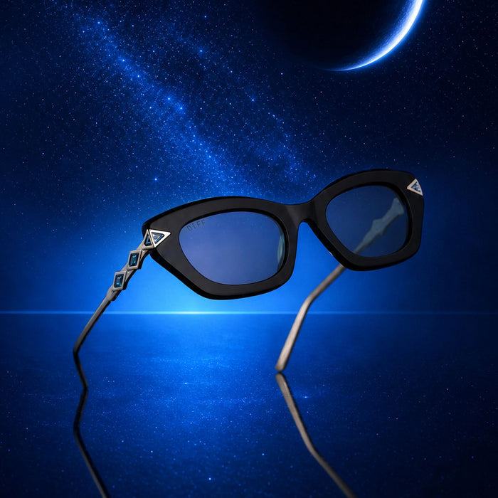 still life - diff eyewear x disney princess featuring the jasmine 2.0 cateye sunglasses with a black acetate frame and teal lenses front view with star light