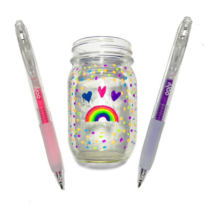 Colored pens and a jar colored with hearts and a rainbow made with OOLY Jelly Gloss Neon Multi-Surface Deco Gel Pens