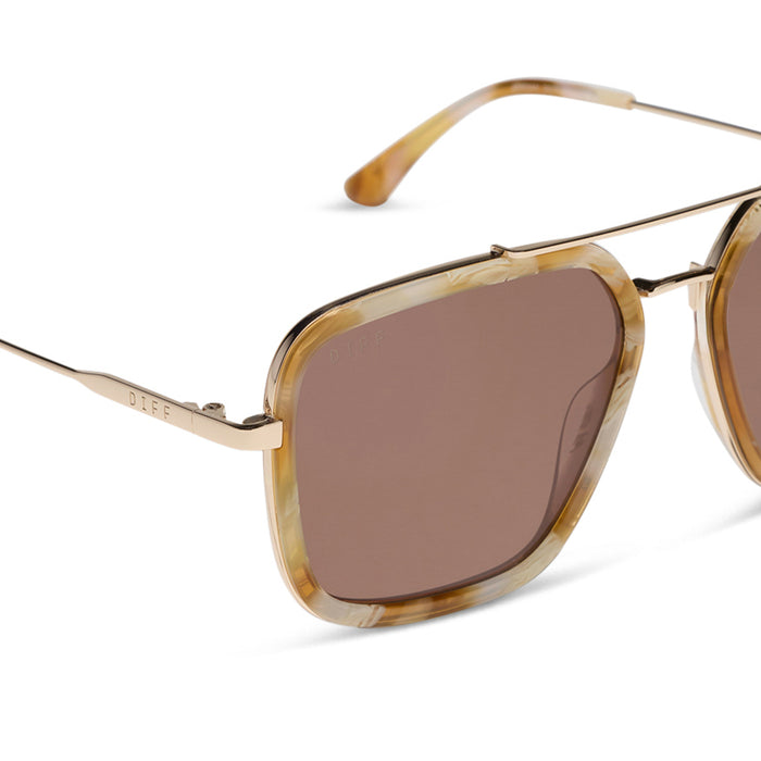 diff eyewear jordan navigator sunglasses with a gilded tortoise acetate and gold metal frame with a brown lens detailed view