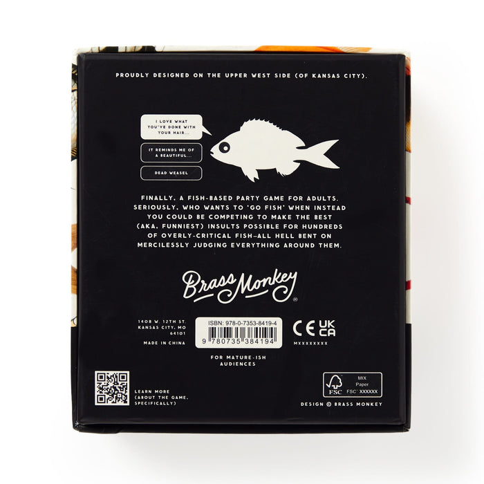 Back of a Brass Monkey Judgy Fish Game box shows a white Judgy Fish illustration, fun fish-themed text, barcode, logos, and a mature-ish age warning. The black box with white and gold details makes it perfect for your next playful insult game!.