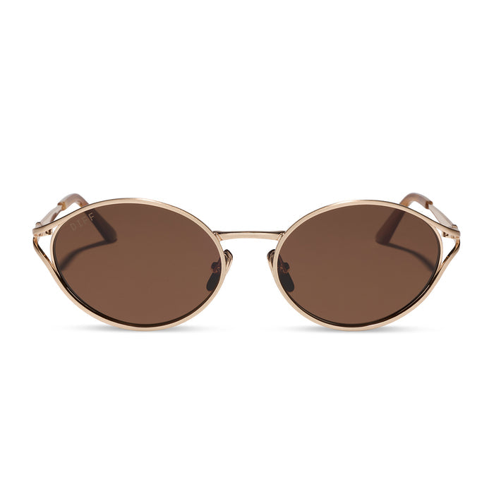 diff eyewear featuring the juliette round sunglasses with a brush gold metal frame and truffle brown polarized lenses front view
