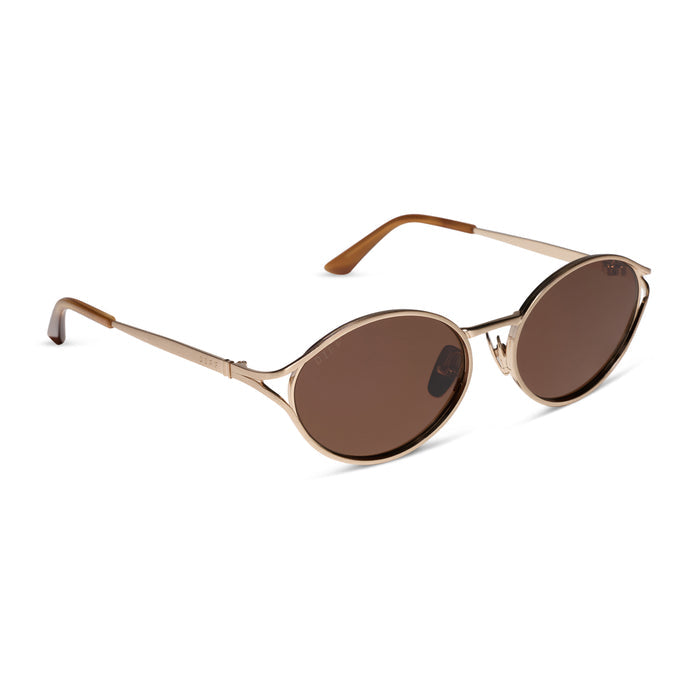 diff eyewear featuring the juliette round sunglasses with a brush gold metal frame and truffle brown polarized lenses angled view