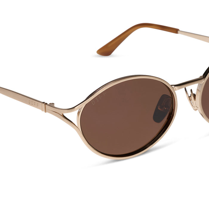 diff eyewear featuring the juliette round sunglasses with a brush gold metal frame and truffle brown polarized lenses detailed view