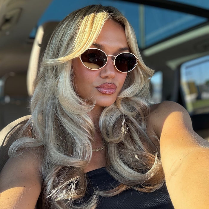 lifestyle - ashley smith wearing gold metal oval frame diff sunglasses