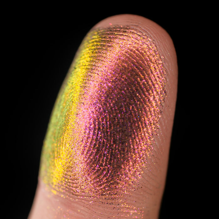 Macro finger swatch of Kiln Lite on fair skin tone.