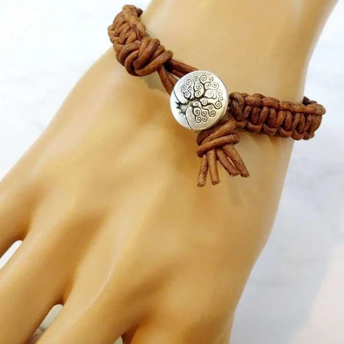 Large Mens Tree of Life Earth Color Macrame Leather Bracelet displayed on a hand, showcasing its intricate design and craftsmanship.