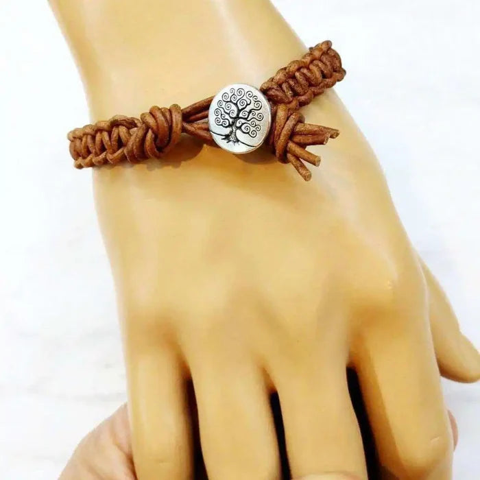 Large Mens Tree of Life Earth Color Macrame Leather Bracelet on a mannequin hand.