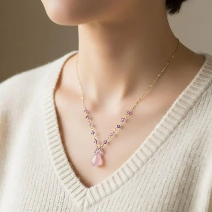 Purple Chalcedony Drop 14 KT Gold Filled Gemstone Necklace worn by a model, showcasing lavender chalcedony and Swarovski crystals.