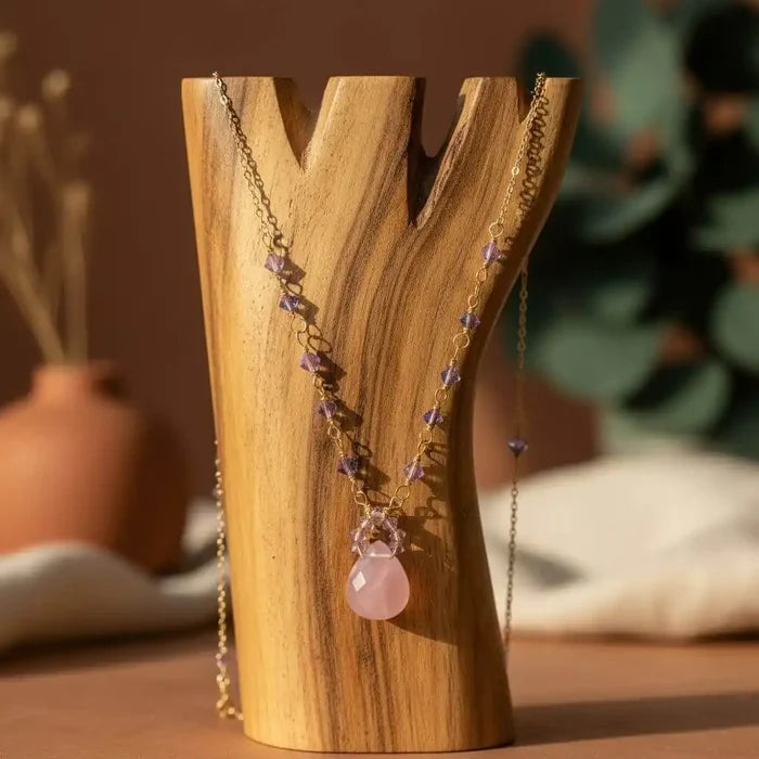 Purple Chalcedony Drop 14 KT Gold Filled Gemstone Necklace displayed on a wooden vase background with lavender accents.