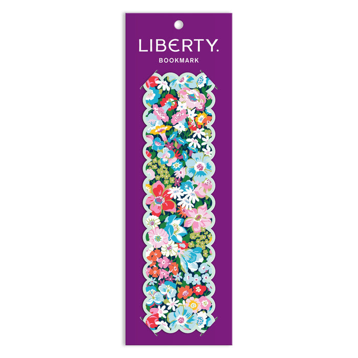 The Liberty of London Ltd Liberty Artemis Shaped Bookmark features a double-sided floral Artemis print in pink, blue, white, and green with scalloped edges, displayed on a purple LIBERTY BOOKMARK card.
