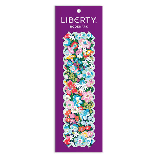 The Liberty of London Ltd Liberty Artemis Shaped Bookmark features a double-sided floral Artemis print in pink, blue, white, and green with scalloped edges, displayed on a purple LIBERTY BOOKMARK card.
