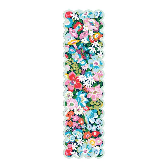 The Liberty Artemis Shaped Bookmark by Liberty of London Ltd is a long, rectangular sticker with scalloped edges, showcasing a colorful floral and green leaf pattern inspired by the Artemis print.