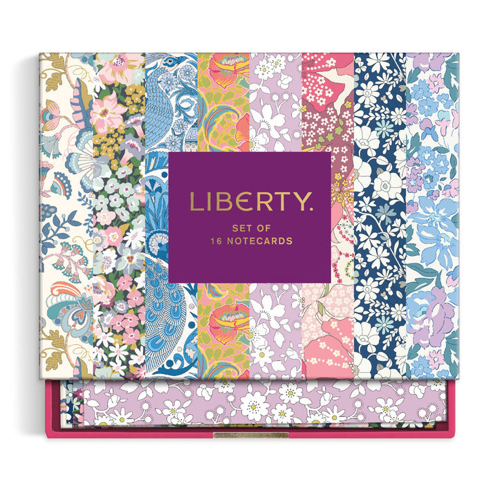 The Liberty Floral Greeting Assortment Notecard Set Volume 2 by Liberty of London Ltd comes in a vibrant box with patterned floral and bird designs in pink, blue, green, and yellow—perfect for stylish greetings.