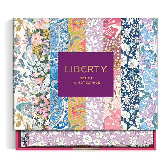 The Liberty Floral Greeting Assortment Notecard Set Volume 2 by Liberty of London Ltd comes in a vibrant box with patterned floral and bird designs in pink, blue, green, and yellow—perfect for stylish greetings.