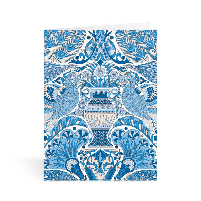 The Liberty Floral Greeting Assortment Notecard Set Volume 2 by Liberty of London Ltd features an ornate card with a blue and white symmetrical design, stylized birds facing a vase, and intricate floral patterns inspired by classic Liberty notecards.
